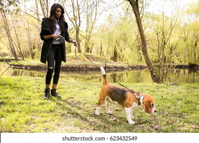 African American Woman Walking Dog