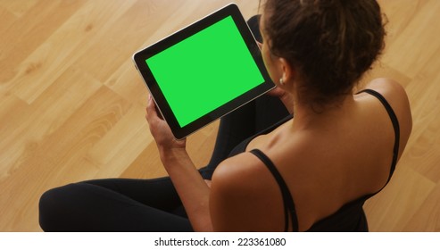 African American woman watching videos on tablet - Powered by Shutterstock