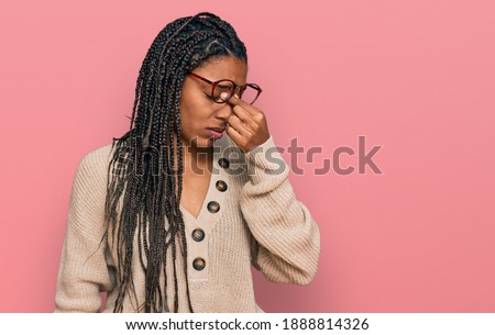 African american woman wearing casual clothes tired rubbing nose and eyes feeling fatigue and headache. stress and frustration concept. 