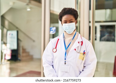 African American Woman Wearing Doctor Uniform And Medical Mask Standing At Street