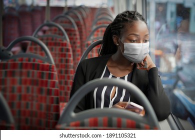 African American Woman Wearing Mask On The Bus While Traveling On Public Transportation In The New Normal