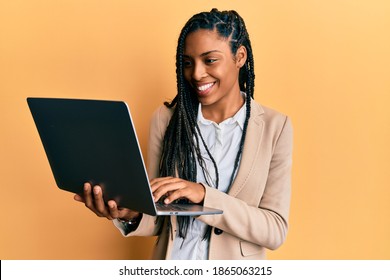 African American Woman Working Using Computer Laptop Smiling With A Happy And Cool Smile On Face. Showing Teeth. 