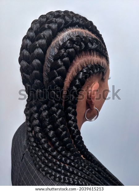 African American Women With\
Hair Braided Into A Cornrow Hairstyle Using Synthetic Hair\
Extensions