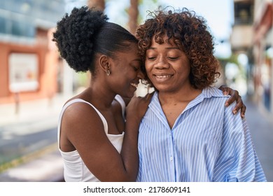 African American Women Mother And Daughter Hugging Each Other At Street