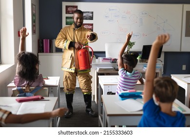 African american young male teacher pointing on multiracial elementary students in safely education. unaltered, education, firefighter, safety, protection, teaching and school concept. - Powered by Shutterstock