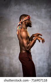 African American Young Man Of Strong Physique Posing In The Studio For A Rap Music Video