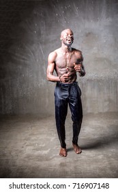 African American Young Man Of Strong Physique Posing In The Studio For A Rap Music Video