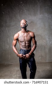 African American Young Man Of Strong Physique Posing In The Studio For A Rap Music Video