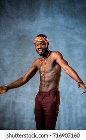 African American Young Man Of Strong Physique Posing In The Studio For A Rap Music Video