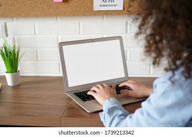 African American Young Woman Student Worker Elearning Working Online From Home Office Typing On Laptop Computer Mock Up White Blank Screen. Web Education Concept. Close Up Over Shoulder Back View.