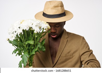 African Appearance A Bouquet Of Flowers A Young Man