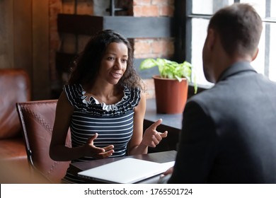 African Applicant Answer Questions At Job Interview Meeting In Cafe With Employer. Human Resources, Staffing Process. Client And Representatives Communication, Make Offer Sell Company Services Concept