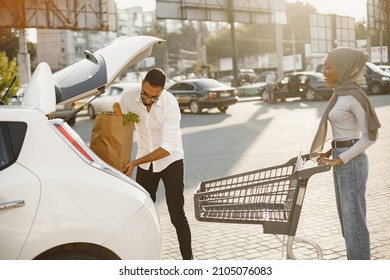 African Arabian Couple Pack Grocery In A Car