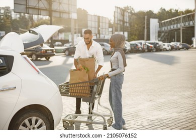 African Arabian Couple Pack Grocery In A Car