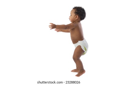 African Baby With Diaper Learning To Walk Isolated Over White