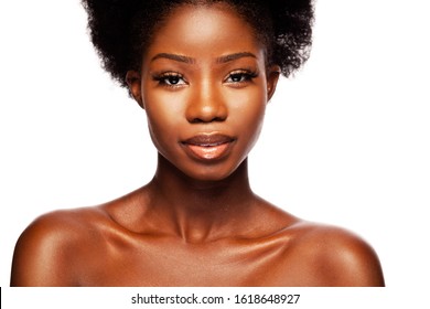 African Beauty Woman. A Young Beautiful African American Woman With Healthy Skin And Long Eyelashes Is Smiling. Black Model Isolated On A White Background In Beauty Concept.