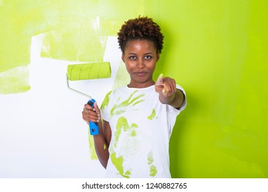 African Black Girl Painting A Wall