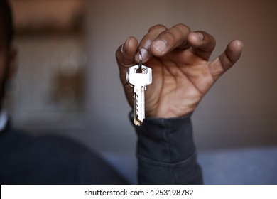 African Black Man Holding Home Keys In Hand.