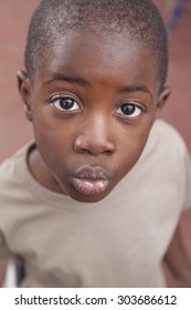 African Boy Giving Kiss Stock Photo (Edit Now) 303686612