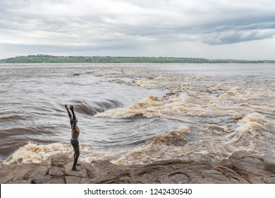 African boy traditional dane on the Congo river in Brazzaville, Congo Republic. Travel to Brazzaville in West-Africa on the Congo river. 