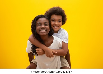 African Brother And Sister. Siblings Bonding. Smiling Black Children Hugging.