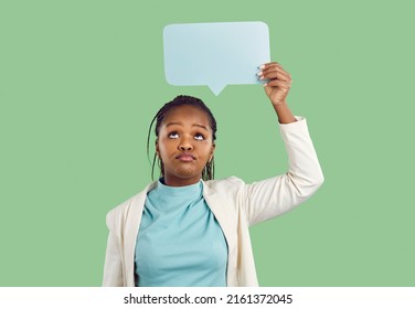 African Business Lady Reads Internet News, Social Media Conversation Silly Answer. Unimpressed Woman Holds Empty Stupid Reply Message Paper Card, Scepticism And Disbelief Face Studio Portrait