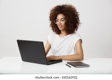 African Business Lady Smiling Working At Laptop Over White Background. 