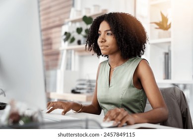 African business woman, smile and monitor in office for career, online digital report and web project. Editor or young person with tech and looking at screen for typing, email or internet research - Powered by Shutterstock