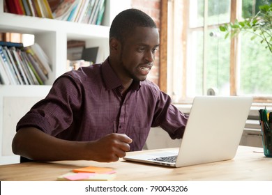 African Businessman Looking At Laptop Screen Frustrated By Bad News, Stressed Man In Tension Cheering Sport Team Watching Match Online, Black Trader Nervous Angry About Stock Trading Market Crisis