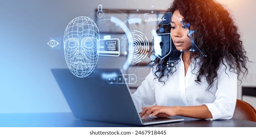 African businesswoman typing in laptop, digital biometric scanning with cyber security. Face detection and personal information hologram. Concept of data protection and facial recognition