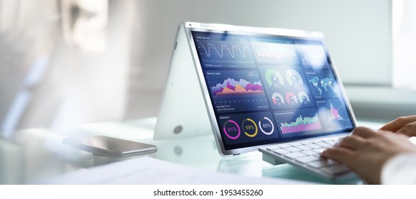 African Businesswoman Using Analytics Data KPI Dashboard Tech - Shutterstock ID 1953455260