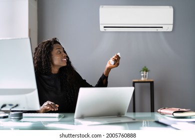 African Businesswoman Working In Office With Air Conditioning