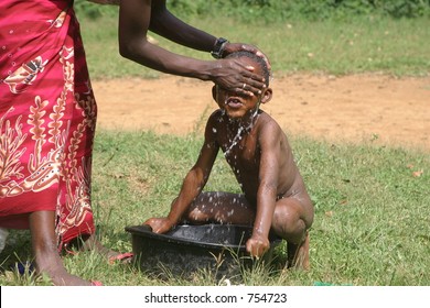 African Child Bathing