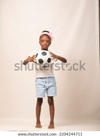 african child and a football 