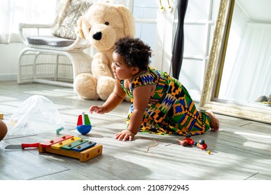 African Children Girl Live With Her Family In Living Room.Happy Africa Female Play Toy With Her Sister.