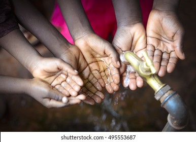 African Children Holding Hands Cupped under Clean Hygienic Water