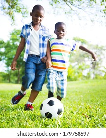 African Children Playing Ball In The Park