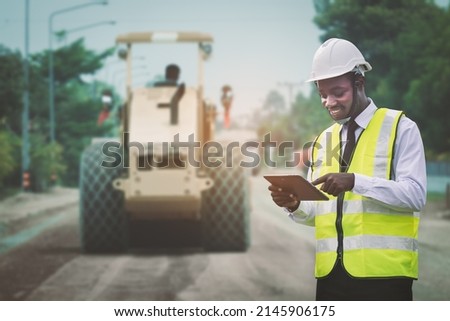 African civil engineering working with use tablet for control the road rebuilding and inspect the construction site Stockfoto © 