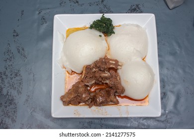 African Corn Meal Pap Staple Food, Goat Stew And Pumpkin Leaves