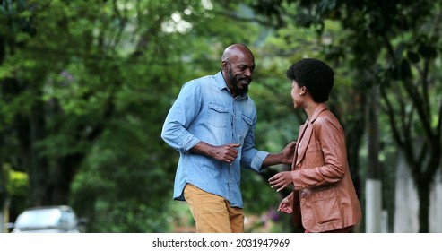 African Couple Dancing Outside In Street