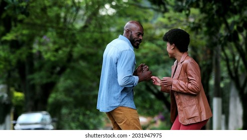 African Couple Dancing Outside In Street