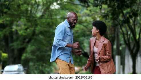 African Couple Dancing Outside In Street