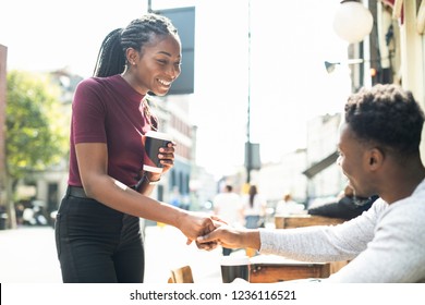 African couple shaking hands together
