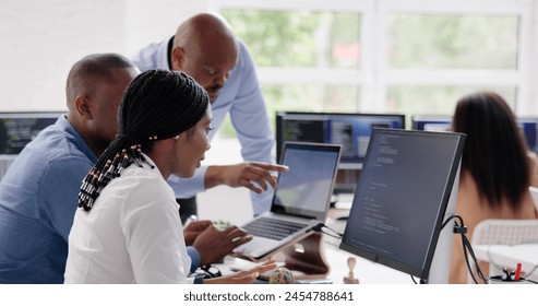 African developer team working on computer code for business
