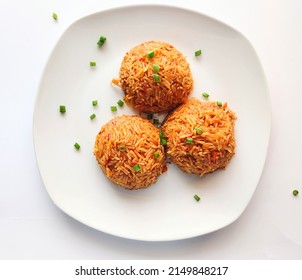 African Dish. Nigerian Jollof Rice Garnished With Spring Onions. Nigerian Meal Made With Basmati Rice Cooked In A Pepper Sauce Full Of Spices. . Usually Served At Nigerian Parties