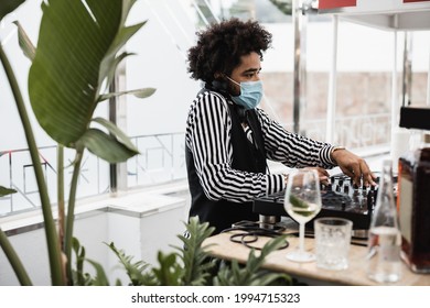 African Dj Playing Music At Cocktail Bar Outdoor While Wearing Face Safety Mask - Focus On Face