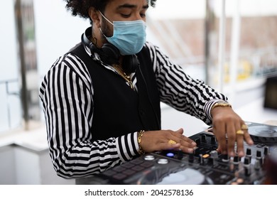 African Dj Playing Music At Cocktail Bar Outdoor While Wearing Face Safety Mask - Focus On Face