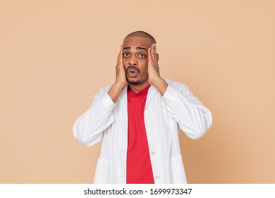 African Doctor Wearing A Lab Coat On A Yellow Background