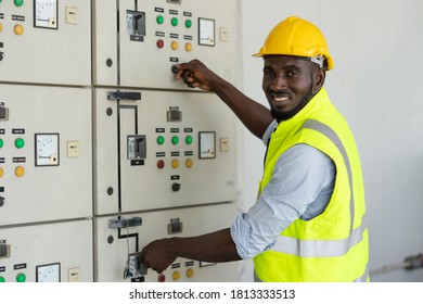 African Electrical Worker Open Power Circuit Breaker Voltage Switch At Warehouse Factory