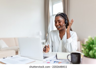 African Elegant Female Entrepreneur Discussing While Having A Conference Call Portrait Of Confident Ethnicity Female Employee Looking At Camera Talking On Video Call In The Home Office.